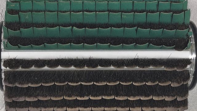Denibbing — removing raised fibers and dust nibs for a smooth, flawless wood finish.